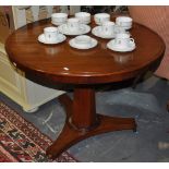 A Victorian mahogany tilt top tea table on triangular platform base