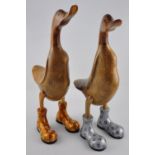 A pair of wooden ducks carved from bamboo,