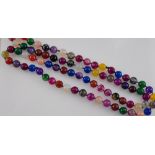 An agate necklace of multi-coloured, round and facetted beads,