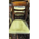 A set of eight Regency style mahogany dining chairs on turned fluted legs (two with arms)