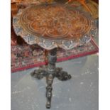 A late 19th Century Flemish carved oak wine table on scroll carved cabriole tripod