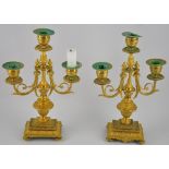 A pair of neo candlesticks style gilt brass 3 branch candlesticks with scroll arms on acanthus cast