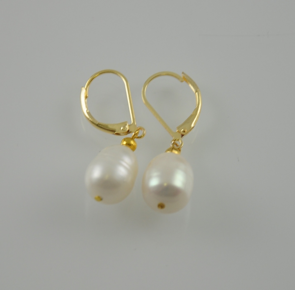 A pair of natural pearl drop earrings with 14ct gold mounts