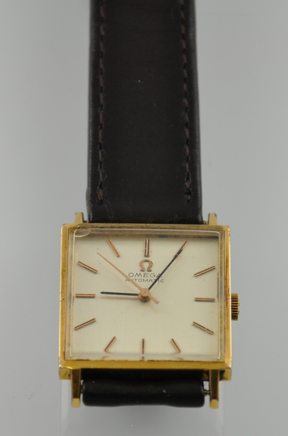 A gold plated square cased Omega automatic wristwatch,