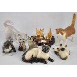 For feline fanciers: four Beswick glazed ceramic figures/groups,