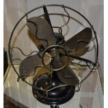 A vintage cast iron and brass propeller desk fan