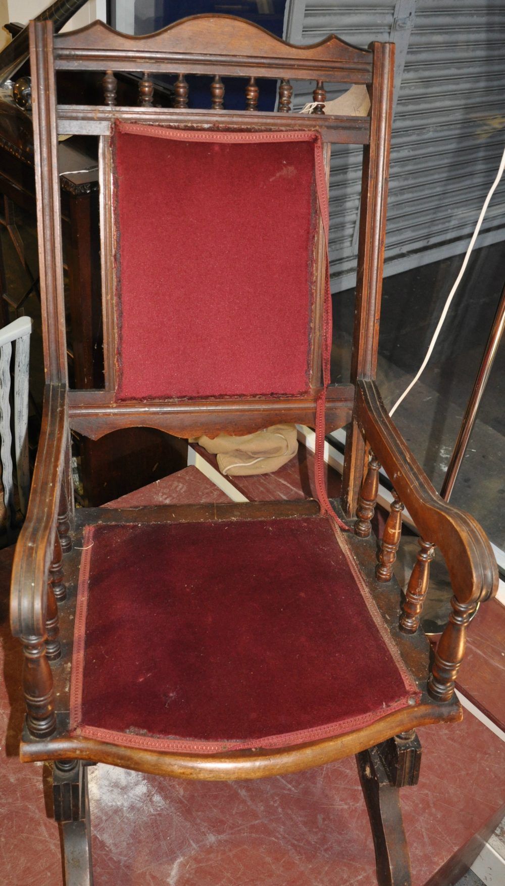 An early 20th Century American upholstered rocking chair