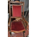 An early 20th Century American upholstered rocking chair