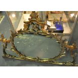 A Rococo style gilt framed over mantle mirror,