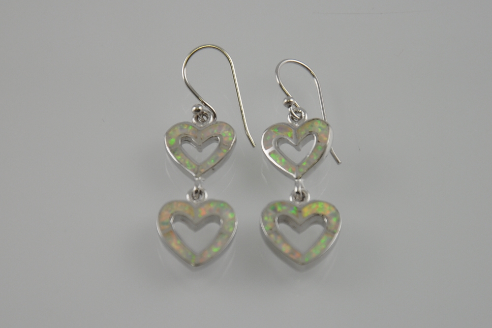 A pair of silver and opalite double heart earrings