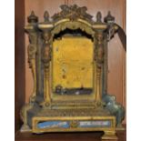 A late 19th Century French ormolu clock case inset painted porcelain panels,