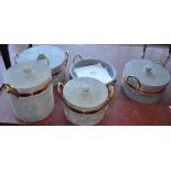 A set of five new Brazilian soapstone saucepans with covers,