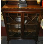 A 1920's Chippendale revival glazed mahogany 2 door display cabinet,