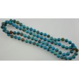 A large blue hardstone necklace with round faceted stones