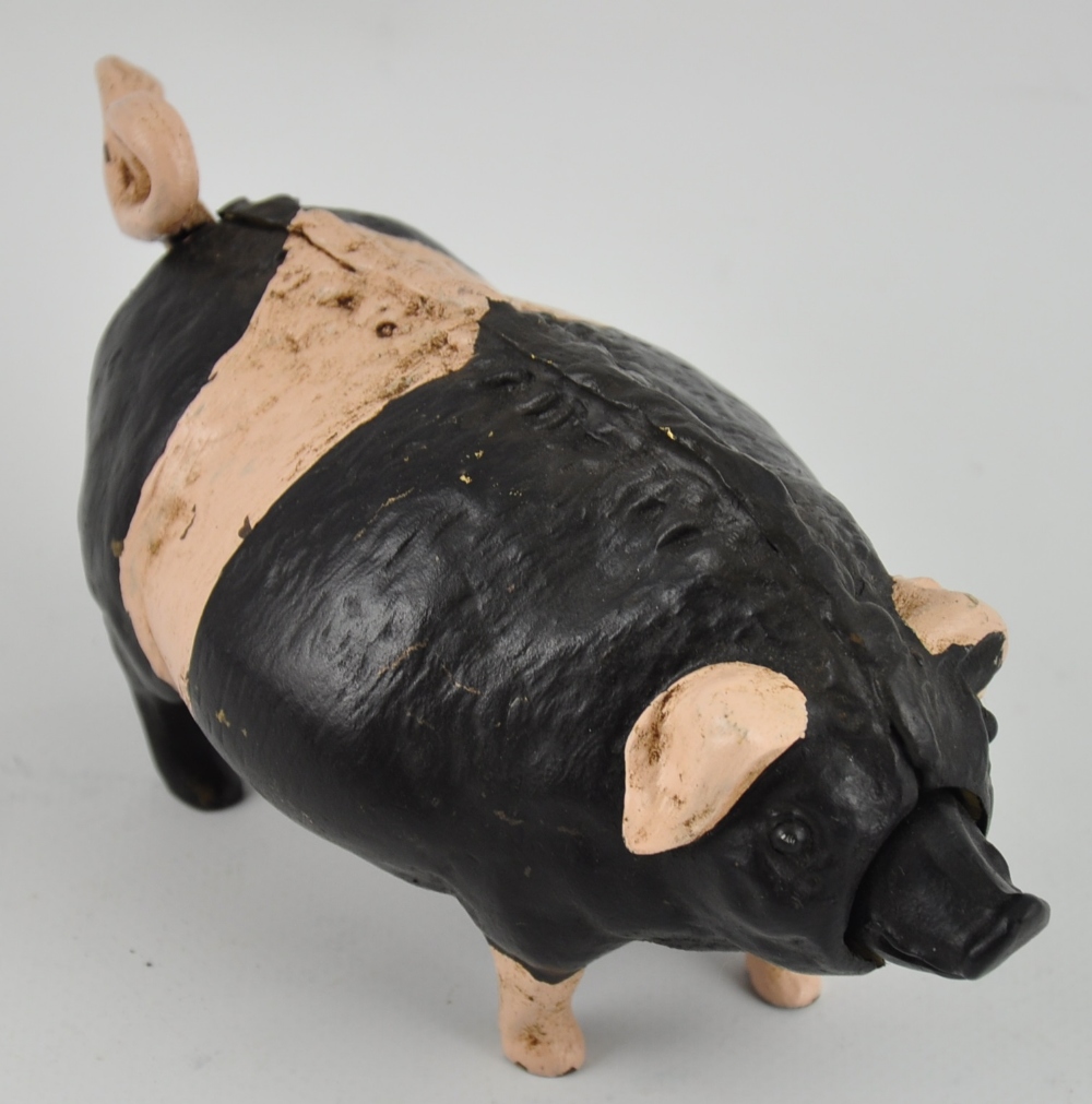 A novelty cold painted bronze pig desk bell