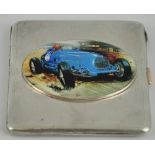 A silver and enamel card case decorated with the image of a Bugati