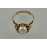A vintage 9ct gold natural pearl ring