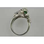 A silver and cubic zirconia Panther Cartier style ring with green eyes