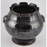 A Chinese pomegranate vase with a dark glazed body and flared mouth, H18.