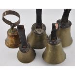 Four Victorian hand bells with leather strop handles together with a hanging door bell