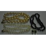 Two strands of cultured pearls with gilt metal clasps,