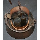 An Eastern copper pan with wrought iron swing handle together with a copper coal scuttle and four