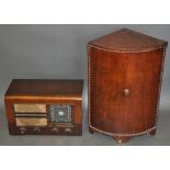 A 1920s corner cabinet with hinged lid on bracket feet, the curved front with beaded border, H.