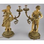 A pair of Victorian style painted spelter table lamps modelled in the form of urchin musicians, H.