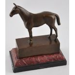 After Andre, a patinated bronze of a standing horse on stepped marble base, H.