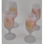 Four contemporary wine glasses, the frosted pink bodies decorated with splashes of yellow and red,