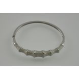 A silver and cubic zirconia bamboo style bracelet
