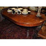 A George III design brass inlaid rosewood twin pedestal extending dining table,