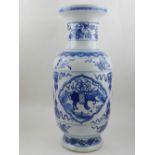 A large 20th century Chinese porcelain baluster vase, decorated with vignettes of animals within
