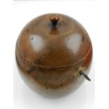 A novelty fruitwood tea caddy in the form of an apple.