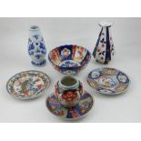 A quantity of Oriental and European porcelain, to include vases, bowl and three cabinet plates