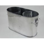 A twin-handled silver plated double wine cooler.