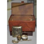 An embossed brown leather jewellery box containing a quantity of Victorian and later small silver