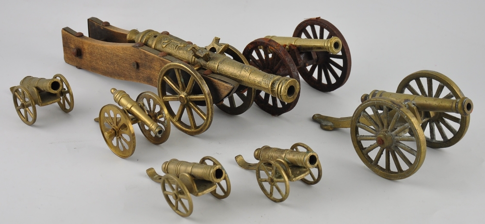 A cast brass model of a seventeenth Century cannon, on wood carriage, L.