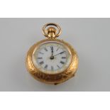 An early 20th Century Continental 14ct yellow gold ladies fob watch with engraved case