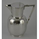 A Christopher Dresser design Victorian silver claret jug with angular handle,