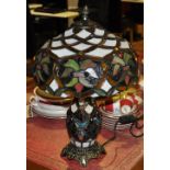 A Tiffany style table lamp, with domed leaded floral shade,