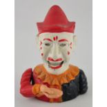 A Victorian cast iron articulated money box modelled as a clown, later repainted, H.
