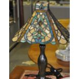 A Tiffany style table lamp with floral square leaded shade,