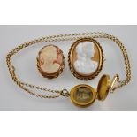 A gold plated Edwardian memorial locket together with two gilt metal oval cameo brooches