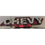 A vintage style tin plate Chevy car sign