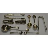 A collection of early 20th Century and later small silver to include a shell, bowl, caddy, spoon,