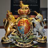 A large painted composition coat of arms wall plaque