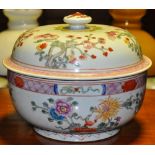 A Chinese famille rose circular porcelain jar and cover decorated with a band of flowers