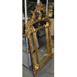 A Louis XVI design gilt framed marginal plate wall mirror with floral cherub surmount,