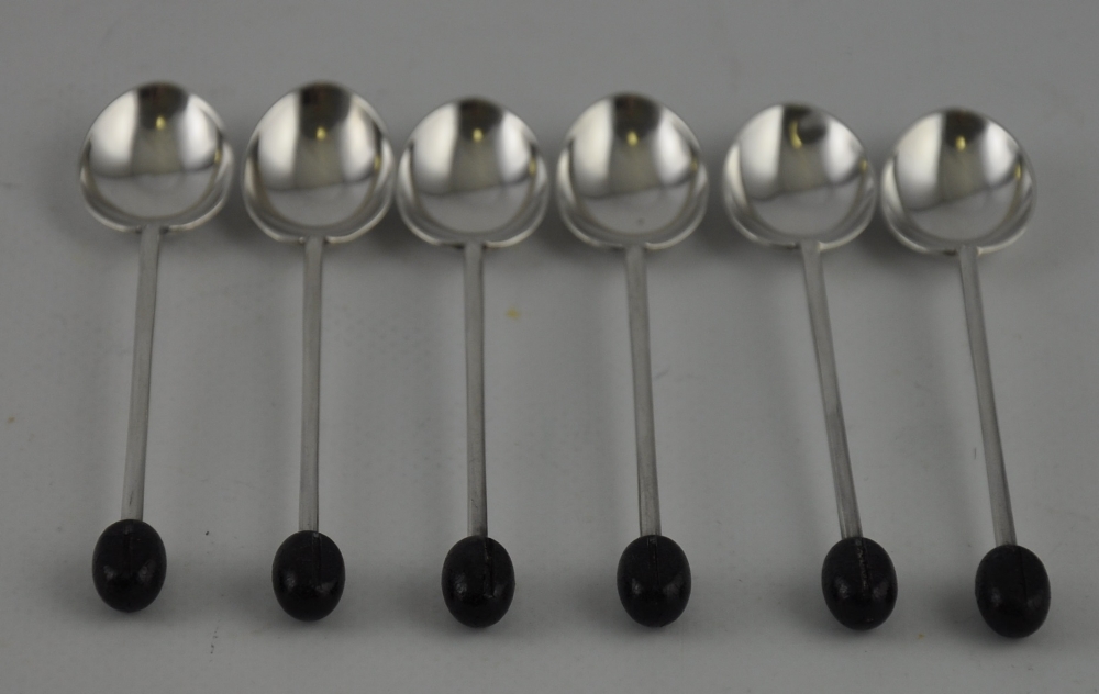 A set of six Art Deco silver coffee spoons with coffee bean finials,